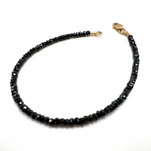 Pulsera en Oro Amarillo 18K y Espinelas Thai negras